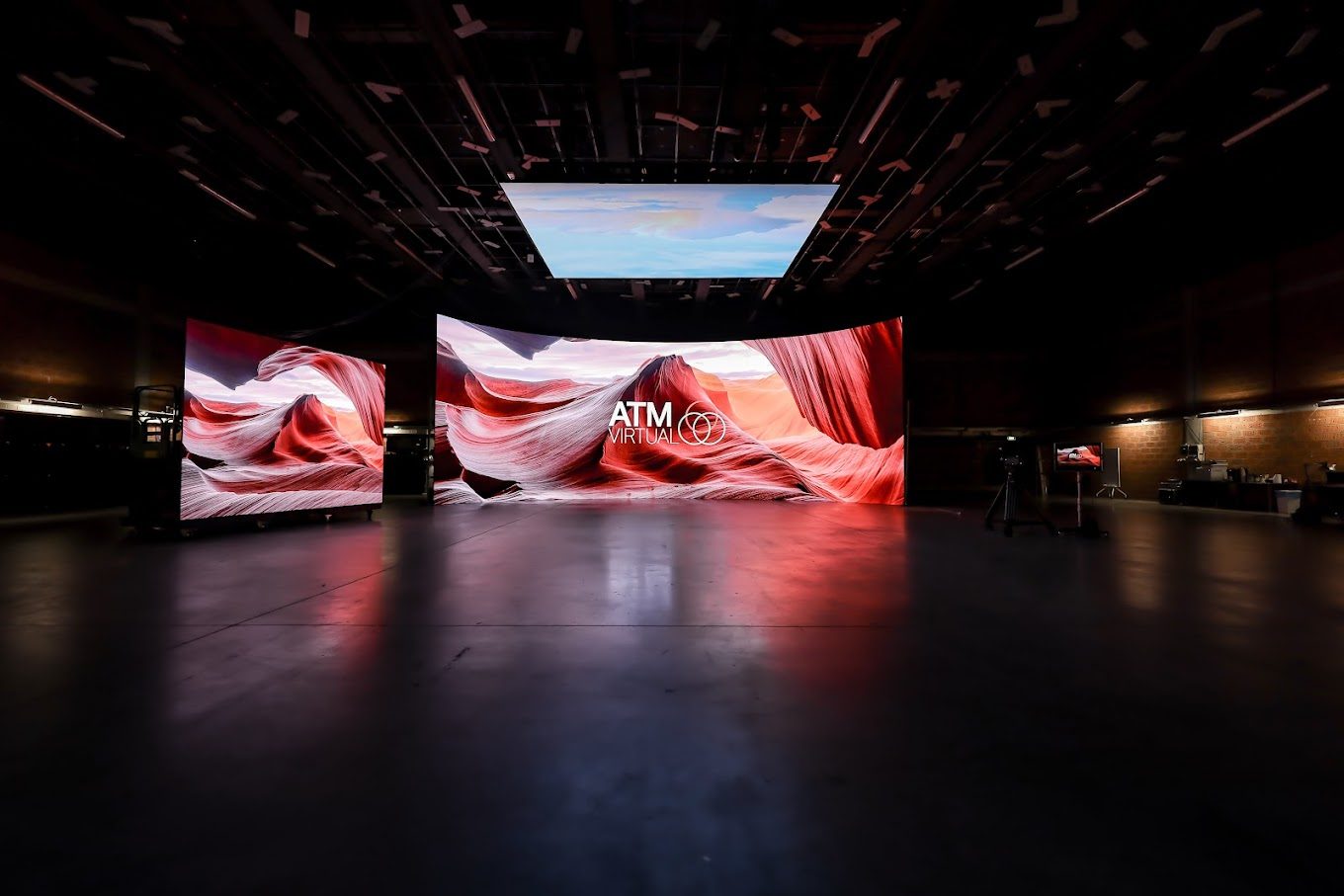 The ATM Virtual LED volume stage: a large curved video wall displaying a canyon landscape inside a darkened sound stage.